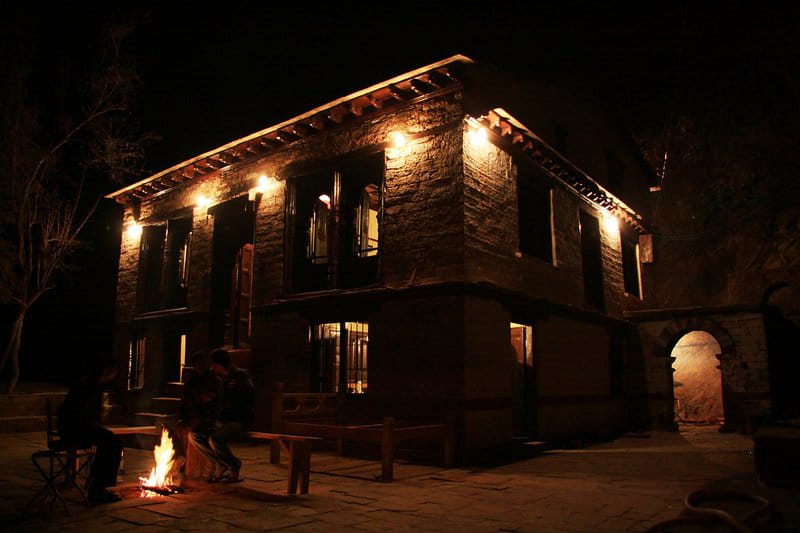 The Daankudi Heritage House illuminated at night