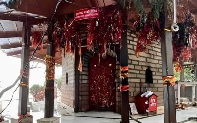 Small Kumaoni style temple nestled in a quiet village setting
