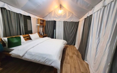 Spacious and comfortable interior of a Luxury Tent with a bed